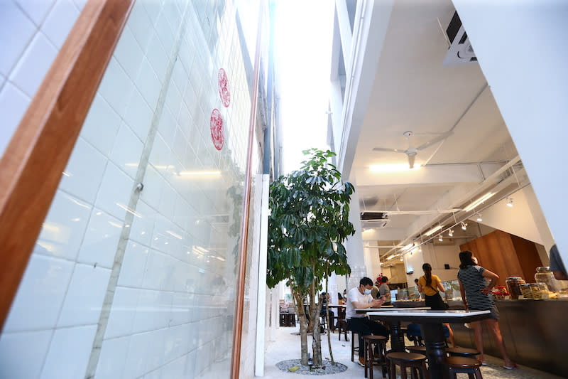 The alley, now under Wisma Chak Kai's ownership, has been reopened up and is part of the bright and airy dine-in area in Fung Wong. — Picture by Ahmad Zamzahuri