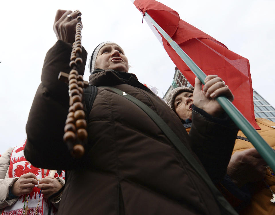 A women pray with rosaries before a march on Independence Day in Warsaw, Poland, Monday, Nov. 11, 2019. (AP Photo/Czarek Sokolowski)