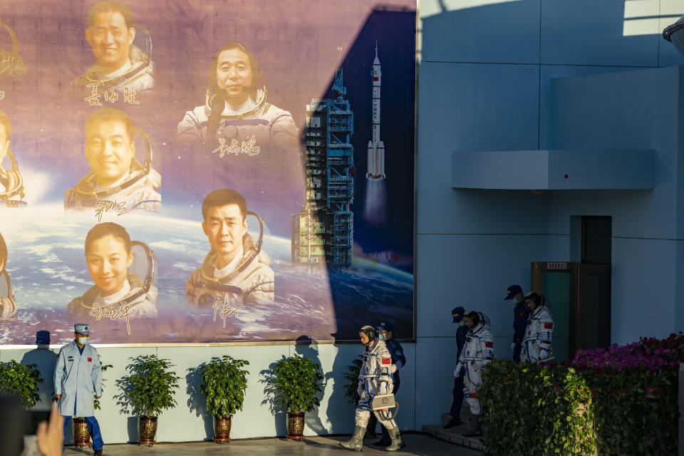 Chinese astronauts prepare to depart on the Shenzhou-12 mission at the Jiuquan Satellite Launch Center in Jiuquan in northwestern China, Thursday, June 17, 2021. Adding a crew to China's new orbiting space station is another major advance for the burgeoning space power. (AP Photo/Ng Han Guan)