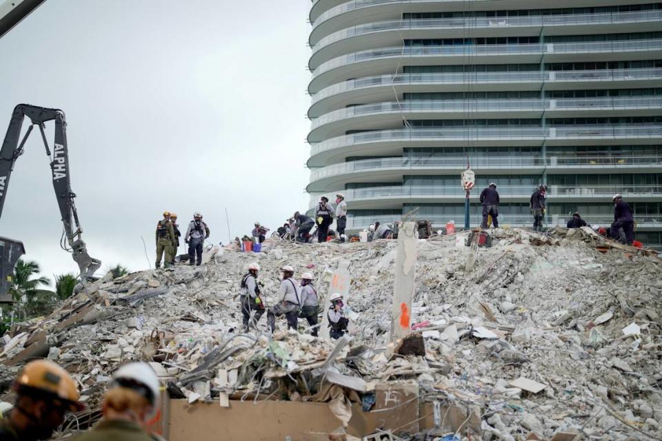 The Eighty Seven Park luxury condo building on June 30, behind the rubble that used to be Champlain Towers South.