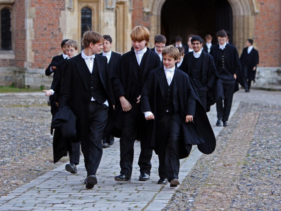 ETON, ENGLAND - MAY 26: Boys make their way to classes across the historic cobbled School Yard of Eton College on May 26, 2008 in Eton, England. An icon amongst private schools, since its founding in 1440 by King Henry VI, Eton has educated 18 British Prime Ministers, as well as prominent authors, artists and members of royal families from around the world. The school caters for some 1300 pupils divided into 25 houses each one overseen by a housemaster chosen from the senior ranks of the staff which number around 160. (Photo by Christopher Furlong/Getty Images)