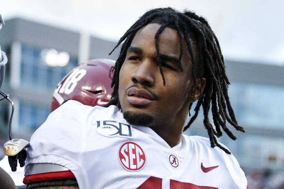 FILE - Alabama wide receiver Jaylen Waddle (17) celebrates with Xavier Williams (9) after scoring a touchdown against Auburn during the first half of an NCAA college football game in Auburn, Ala., in this Saturday, Nov. 30, 2019, file photo. Waddle is a possible first round pick in the NFL Draft, April 29-May 1, 2021, in Cleveland. (AP Photo/Butch Dill, File)