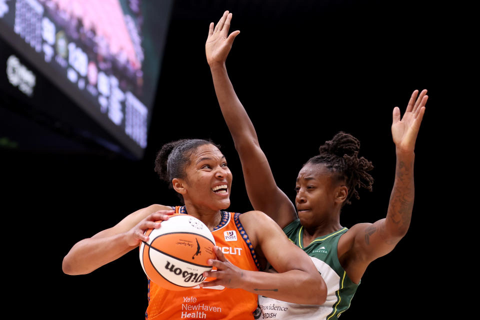 Sun forward Alyssa Thomas looks to shoot against Storm guard Jewell Loyd during the third quarter of their game on June 20, 2023 in Seattle. (Steph Chambers/Getty Images)