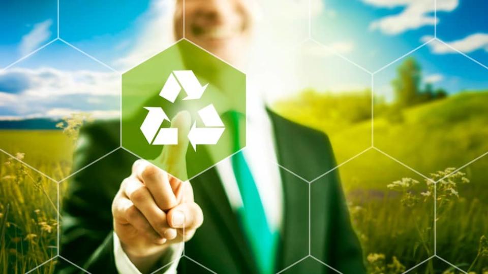 Man pointing at a recycling symbol