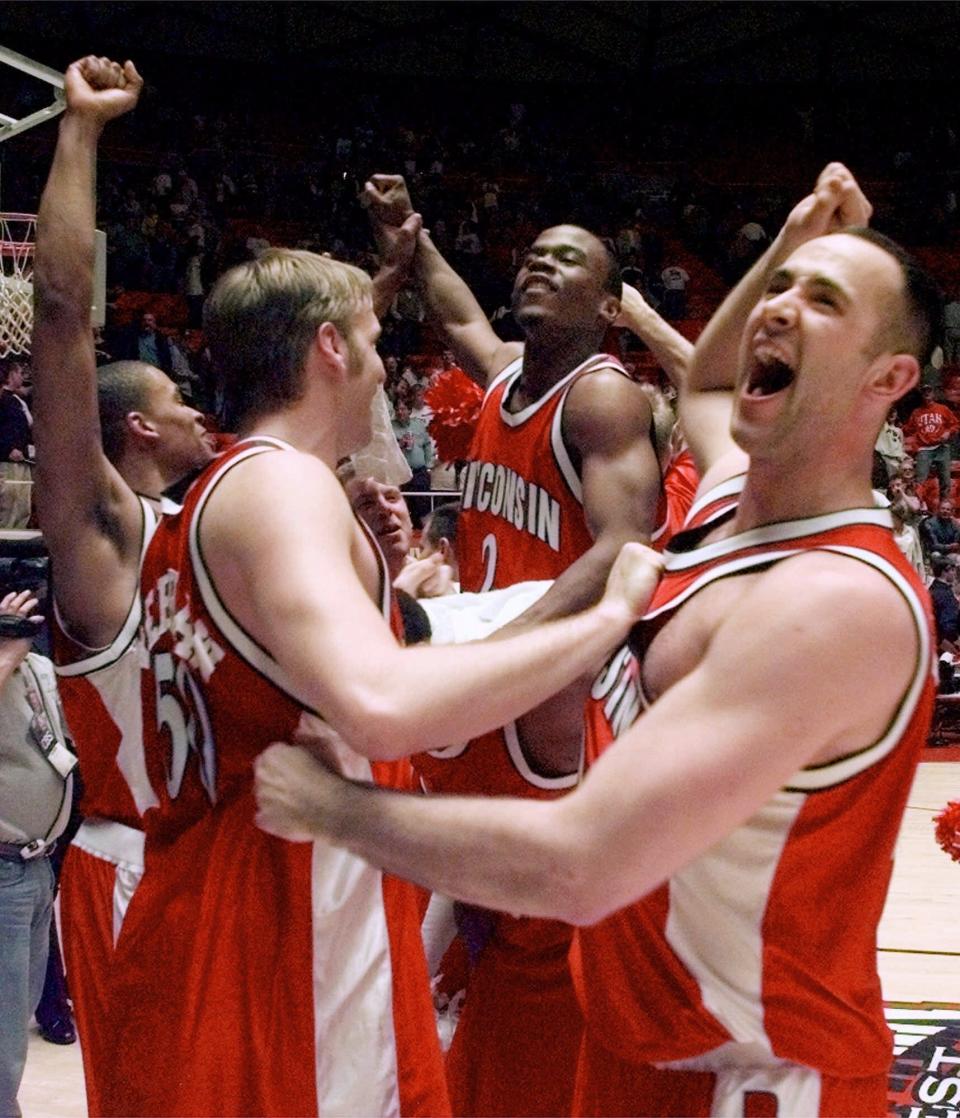 Charlie Wills (right) celebrates with teammates in an NCAA Tournament game in 2000.