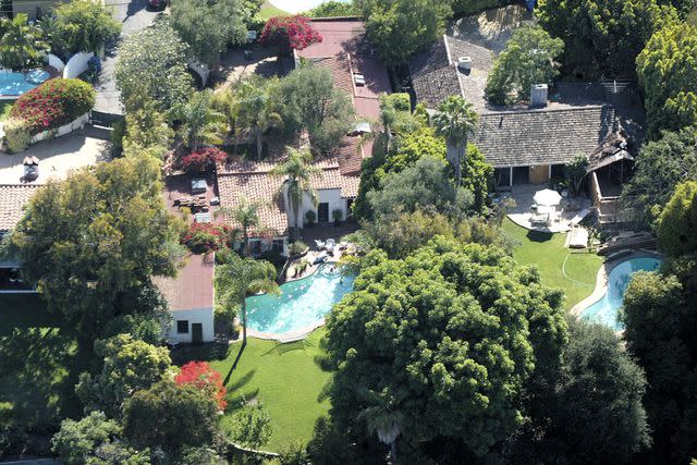 <p>Mel Bouzad/Getty</p> An aerial view of the house where actress Marilyn Monroe died is seen on July 26, 2002 in Brentwood, California.