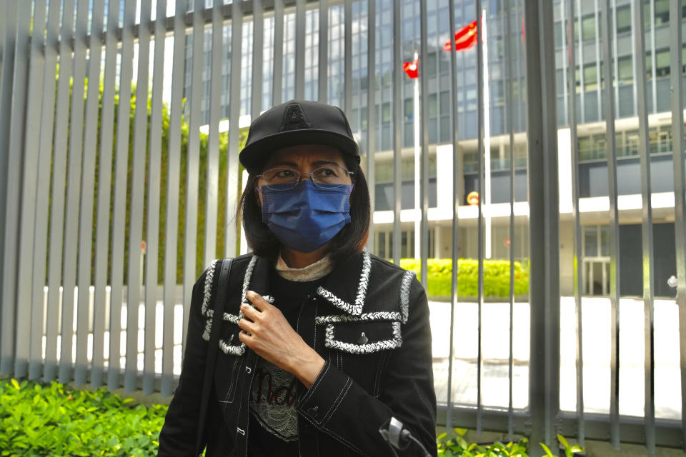 Mrs. Poon, the mother of a young woman killed in Taiwan, speaks to the media outside the government headquarters in Hong Kong, Wednesday, Oct. 20, 2021. Mrs. Poon, whose daughter Poon Hiu-wing was killed while visiting Taiwan in 2018, has lambasted Hong Kong authorities for letting suspect Chan Tong-kai walk free, instead of sending him to Taiwan to turn himself in. (AP Photo/Kin Cheung)