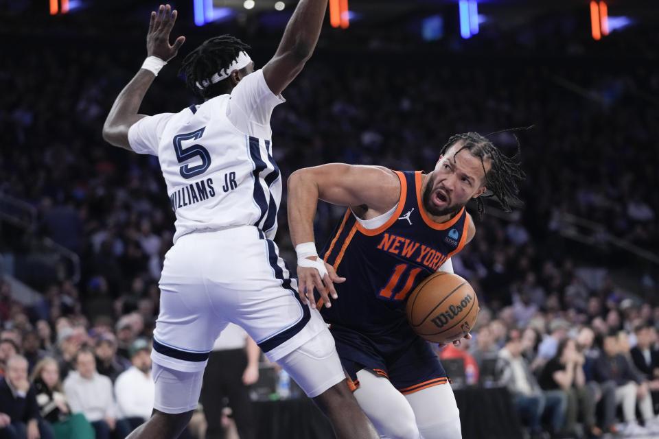 New York Knicks guard Jalen Brunson drives against Memphis Grizzlies guard Vince Williams Jr. (5) during the first half of an NBA basketball game, Tuesday, Feb. 6, 2024, at Madison Square Garden in New York. (AP Photo/Mary Altaffer)