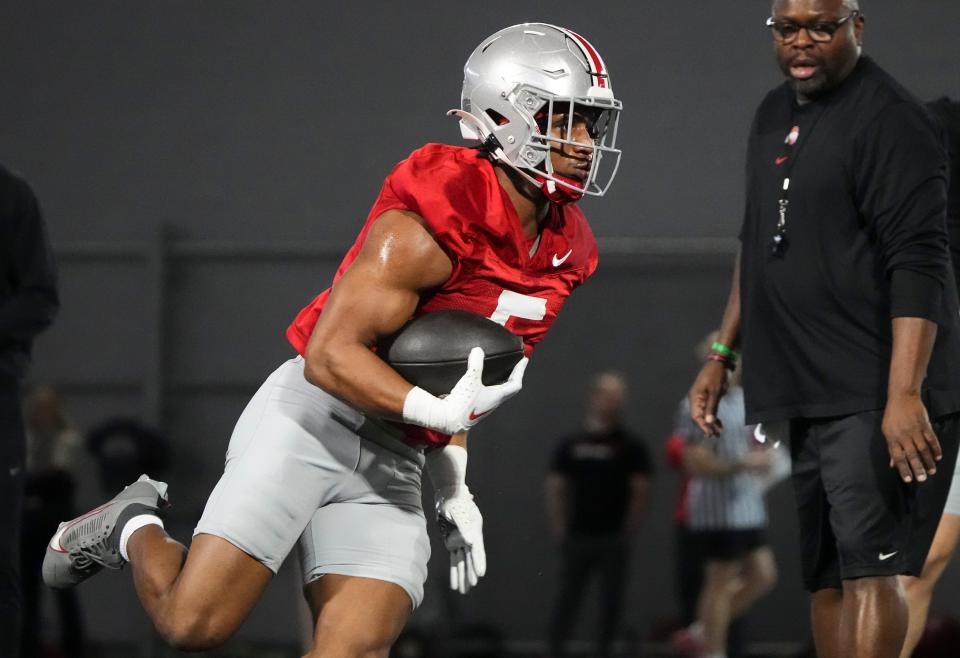 Mar 7, 2024; Columbus, OH, USA; Ohio State Buckeyes running back Dallan Hayden (5) runs during spring football practice at the Woody Hayes Athletic Center.