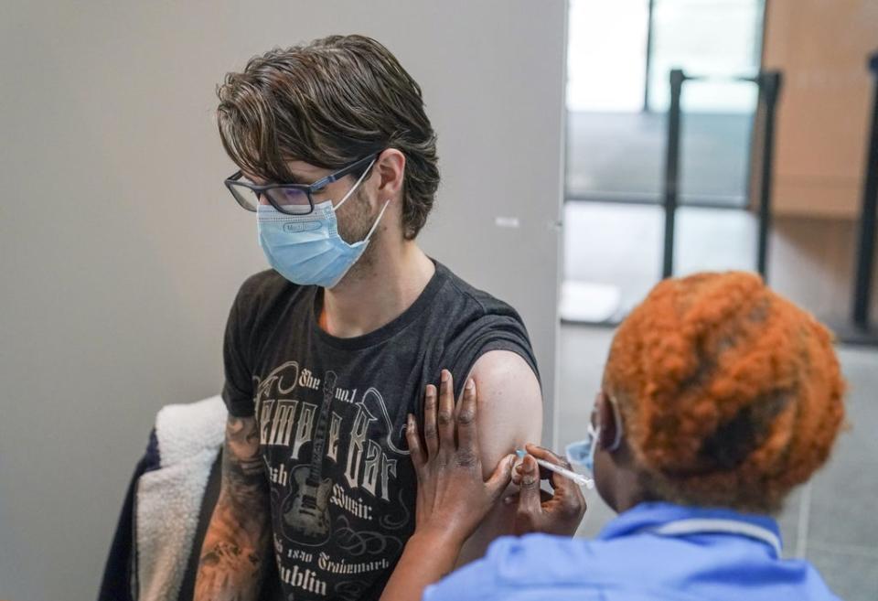 Nurse Marvis Birungi prepares to give a vaccine injection in a pop-up vaccination clinic at the Oxford Brookes University’s Headington Campus in Oxford (Steve Parsons/PA) (PA Wire)