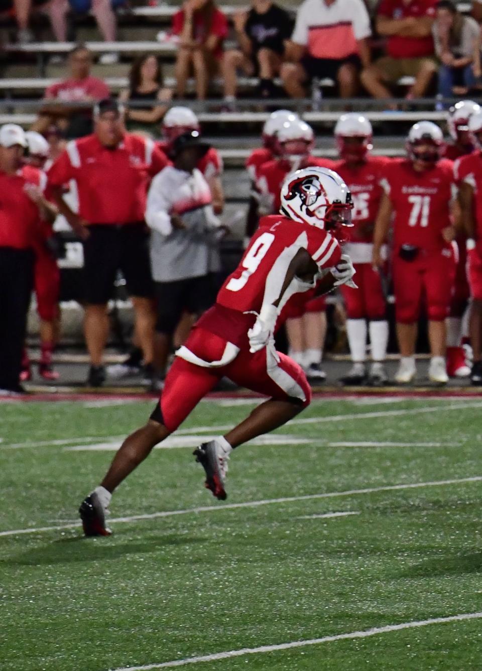 Koy Beasley, shown picking off a Louisville Trinity pass for La Salle High School in their 2022 game, is a four-star recruit.