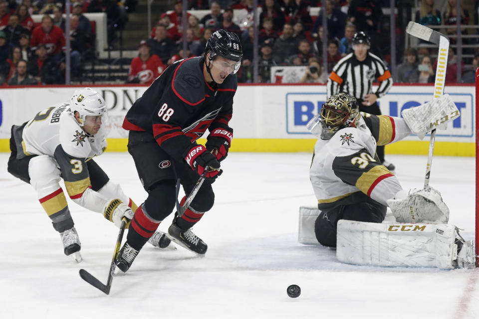 Vegas Golden Knights defenseman Brayden McNabb (3) and goaltender Malcolm Subban (30) defend the net against Carolina Hurricanes center Martin Necas (88), of the Czech Republic, during the second period of an NHL hockey game in Raleigh, N.C., Friday, Jan. 31, 2020. (AP Photo/Gerry Broome)