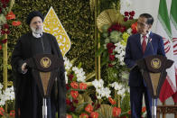 Iran's President Ebrahim Raisi, left, speaks to journalists as Indonesian President Joko Widodo listens during a joint press conference at the Presidential Palace in Bogor, West Java, Indonesia, Tuesday, May 23, 2023. (AP Photo/Achmad Ibrahim)