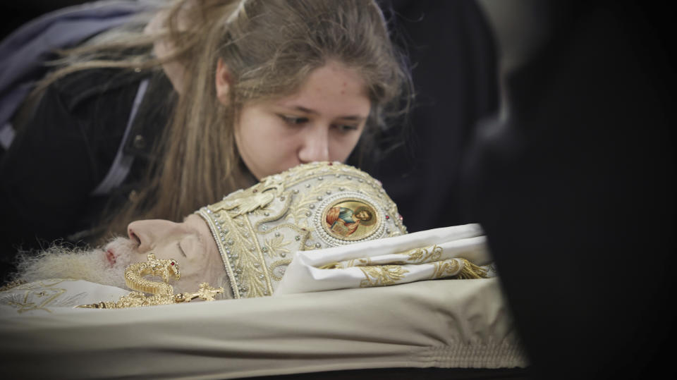 A believer pays her last respects to Bulgarian patriarch Neophyte at the Alexander Nevsky Cathedral in Sofia, Friday, March 15, 2024.National mourning was declared by the Bulgarian government on March 15 and 16 to honour Patriarch Neophyte of Bulgaria. Neophyte who was the first elected head of the Orthodox Church in the post-communist Balkan country, died at a hospital in Sofia on March 13. He was 78. (AP Photo/Valentina Petrova)