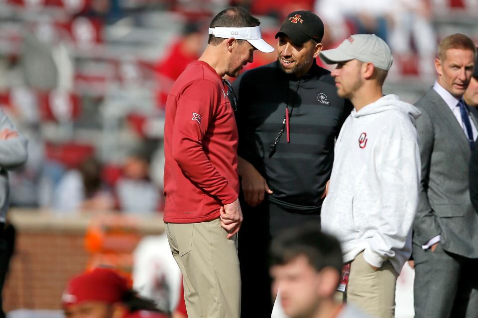 Oklahoma coach Lincoln Riley talks with Iowa State coach Matt Campbell on Nov. 20 in Norman.