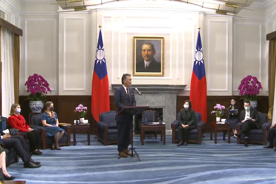 In this image made from video released by the Taiwan Presidential Office, U.S. Representative Mark Takano, D-Calif. speaks during a meeting with Taiwanese President Tsai Ing-wen, sitting center right, at the Presidential Office in Taipei, Taiwan on Friday, Nov. 26, 2021. Five U.S. lawmakers met with Taiwan President Tsai Friday morning in a surprise one-day visit intended to reaffirm the United States' "rock solid" support for the self-governing island. (Taiwan Presidential Office via AP)