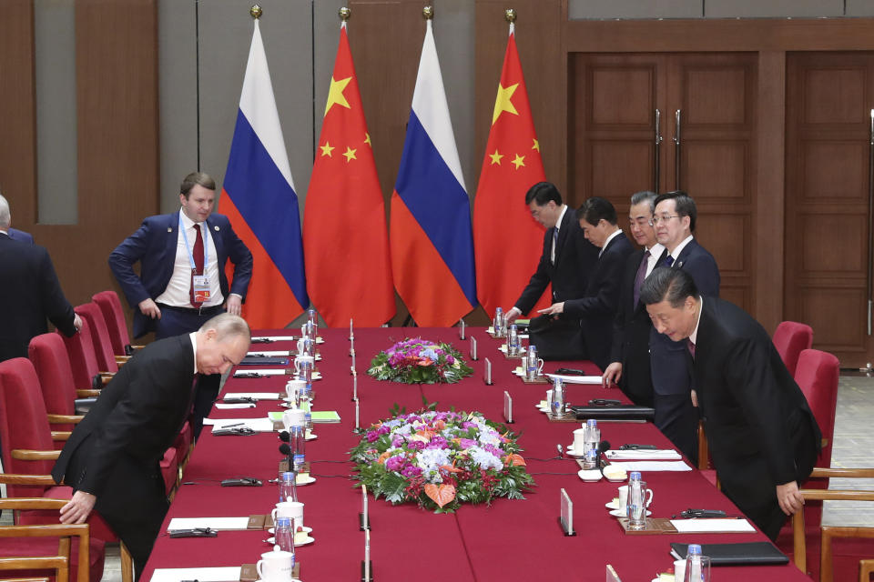 Russian President Vladimir Putin, left, and Chinese President Xi Jinping, right, attend the meeting in Beijing Friday, April 26, 2019. (Kenzaburo Fukuhara/Pool Photo via AP)