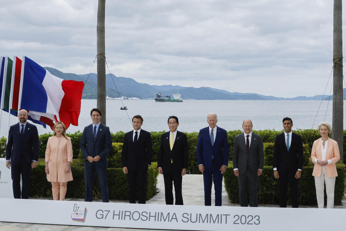 From left, President of the European Council Charles Michel, Italy's Prime Minister Giorgia Meloni, Canada's Prime Minister Justin Trudeau, France's President Emmanuel Macron, Japan's Prime Minister Fumio Kishida, U.S. President Joe Biden, Germany's Chancellor Olaf Scholz, Britain's Prime Minister Rishi Sunak and European Commission President Ursula von der Leyen participate in a family photo with G7 leaders before their working lunch meeting on economic security during the G7 summit, at the Grand Prince Hotel in Hiroshima, western Japan Saturday, May 20, 2023. (Jonathan Ernst/Pool Photo via AP)