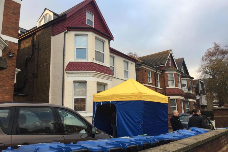 A forensics tent set up in the driveway of the house in Harlesden