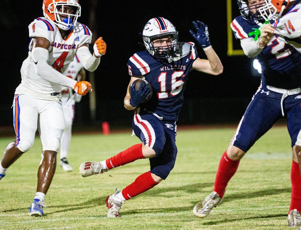 Fletcher Kean of the Estero High School football runs for yards during a game against Cape Coral High School on Friday, Sept. 22, 2023. Estero won 38-0