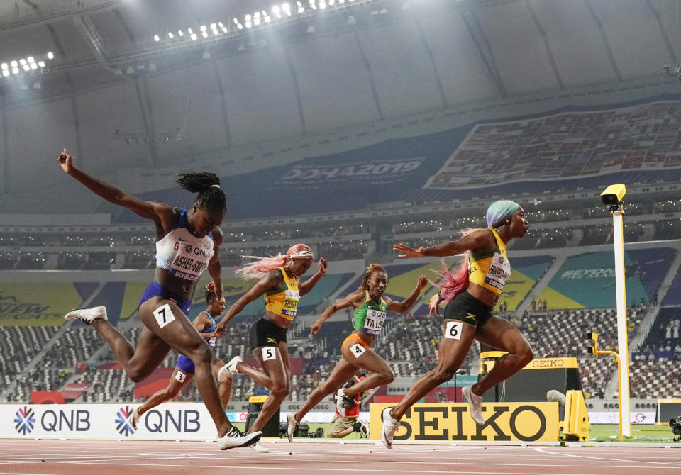 FILE - Shelly-Ann Fraser-Pryce (6), of Jamaica, finishes ahead of Dina Asher-Smith (7), of Britain, and Marie-Josée Ta Lou (4), of The Ivory Coast, in the women's 100-meter final at the World Athletics Championships in Doha, Qatar, Sept. 29, 2019. Once again, the hallowed women’s sprint records held by the late Florence Griffith Joyner – 10.49 in the 100 and 21.34 in the 200 – appear to be in jeopardy.(AP Photo/David J. Phillip, File)