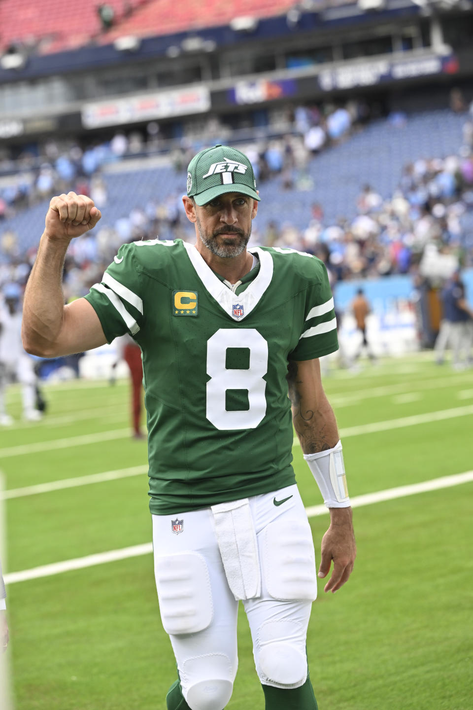 New York Jets quarterback Aaron Rodgers (8) walks off the field after an NFL football game against the Tennessee Titans in Nashville, Tenn., on Sunday, Sept. 15, 2024. (AP Photo/John Amis)