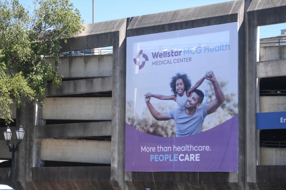 The new Wellstar MCG Health Medical Center banner hangs outside Augusta University on Thursday, Aug. 31, 2023.