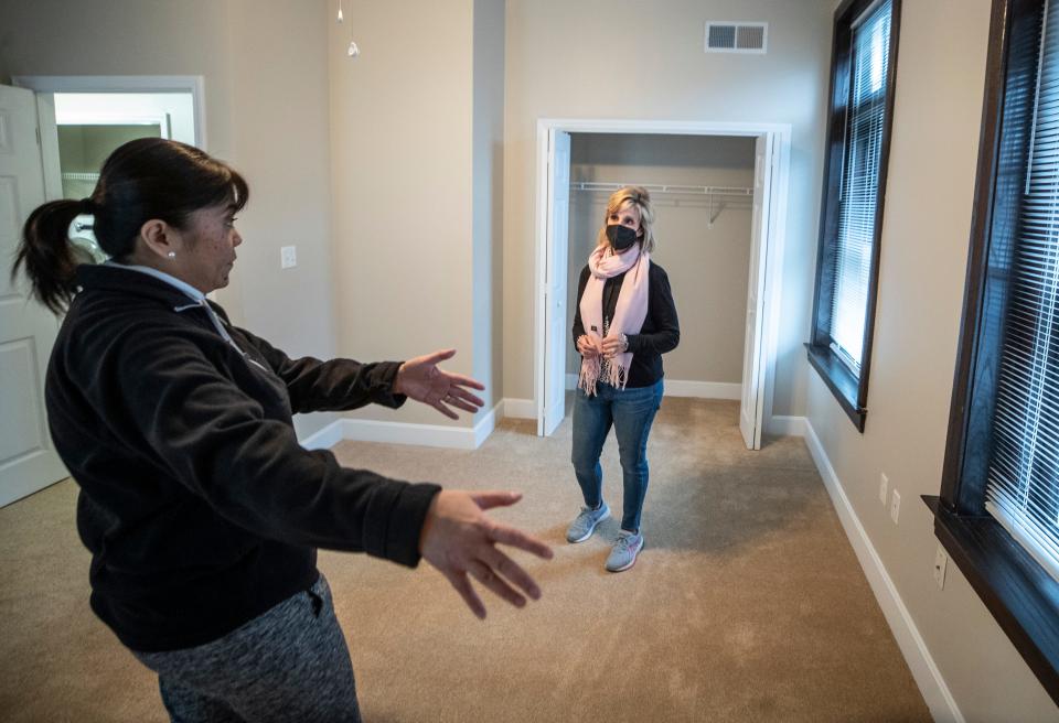 Kay Barringer, right, talks with Rosemay Palmer-Ball, left, idiscuss where furniture will go in the bedroom of her mother's new apartment at the Masonic Home. Barringer's company helps the elderly move from their homes to assisted living. Jan 14, 2022