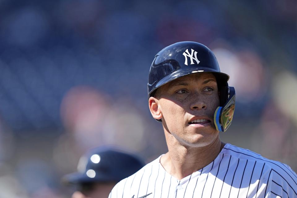 New York Yankees' Aaron Judge walks out to the dugout after flying out against the Washington Nationals during the third inning of a spring training baseball game Wednesday, March 1, 2023, in Tampa, Fla. (AP Photo/David J. Phillip)