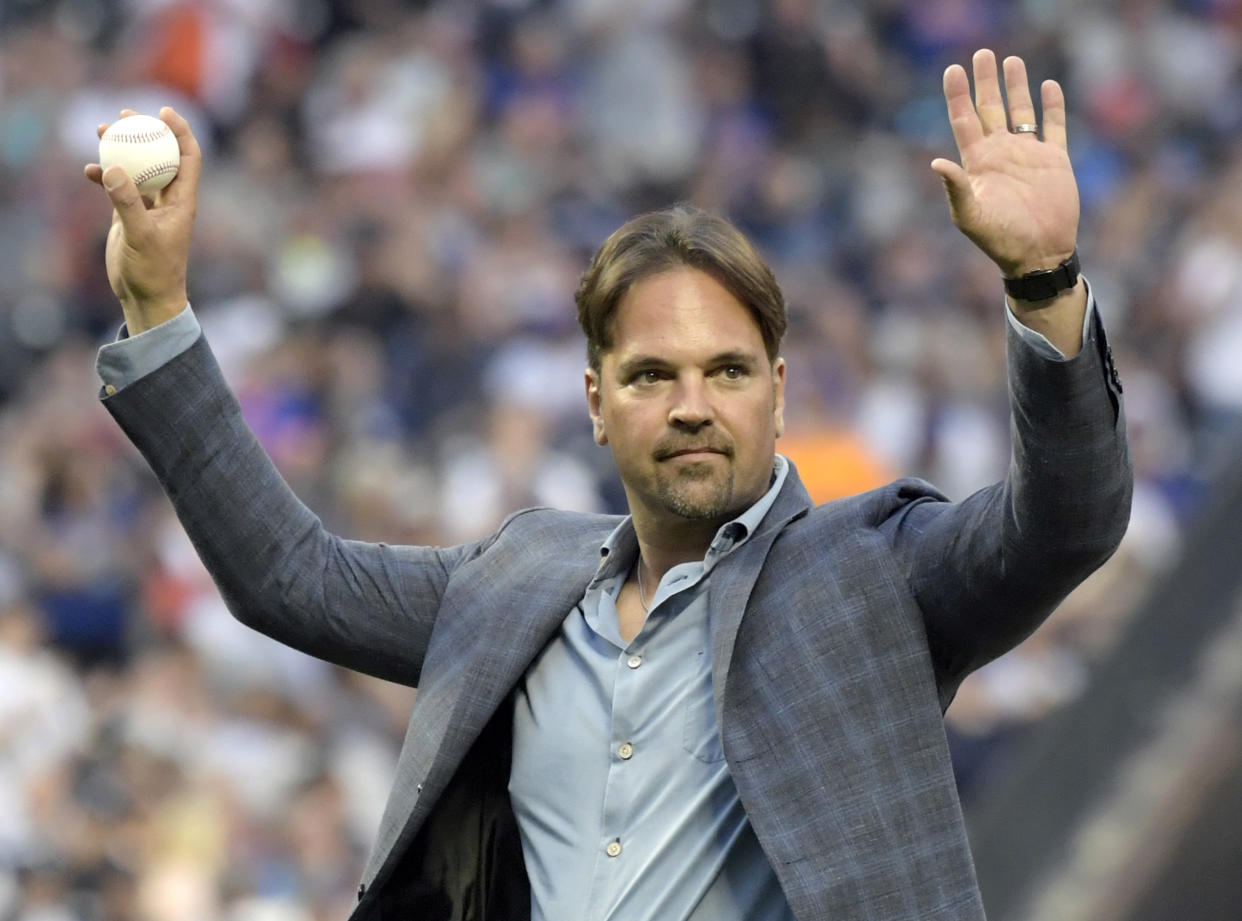 Former New York Mets catcher Mike Piazza acknowledges the fans before throwing out the ceremonial first pitch before a Mets baseball game against the New York Yankees, Saturday, June 9, 2018, in New York. (AP Photo/Bill Kostroun)