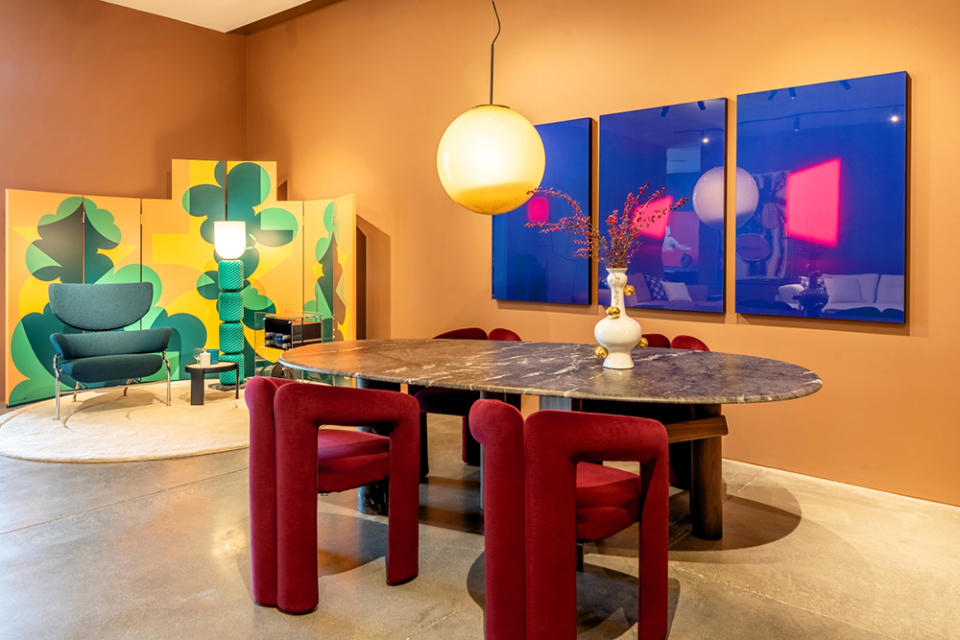 Dudet chairs and Sengu dining table, both by Patricia Urquiola, Tre Pezzi armchair (in green) by Franco Albini, and pair of Balla screens by Giacomo Balla.