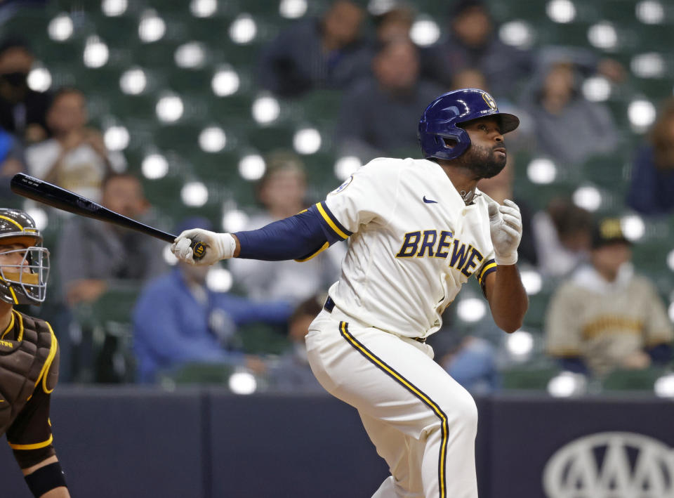 Milwaukee Brewers center fielder Jackie Bradley Jr. (41) watches his game winning single against the San Diego Padres in the tenth inning of a baseball game Thursday, May 27, 2021, in Milwaukee. (AP Photo/Jeffrey Phelps)