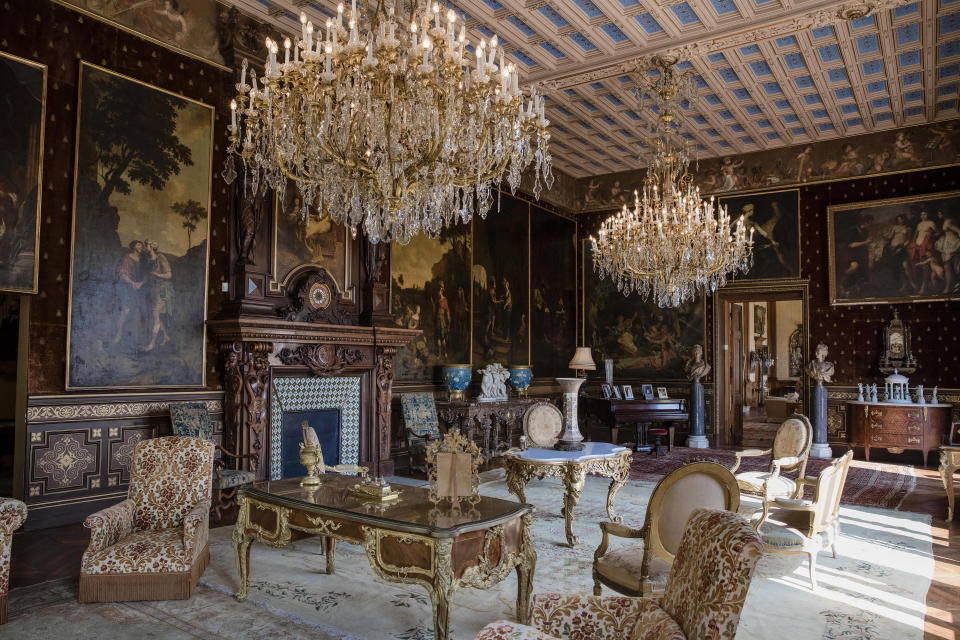 <p>Chandeliers hang over armchairs and tables in of a sitting room inside the sprawling villa. The most recent private owners, the Marnier-Lapostolle family, are best known for making the Grand Marnier liquer. </p>