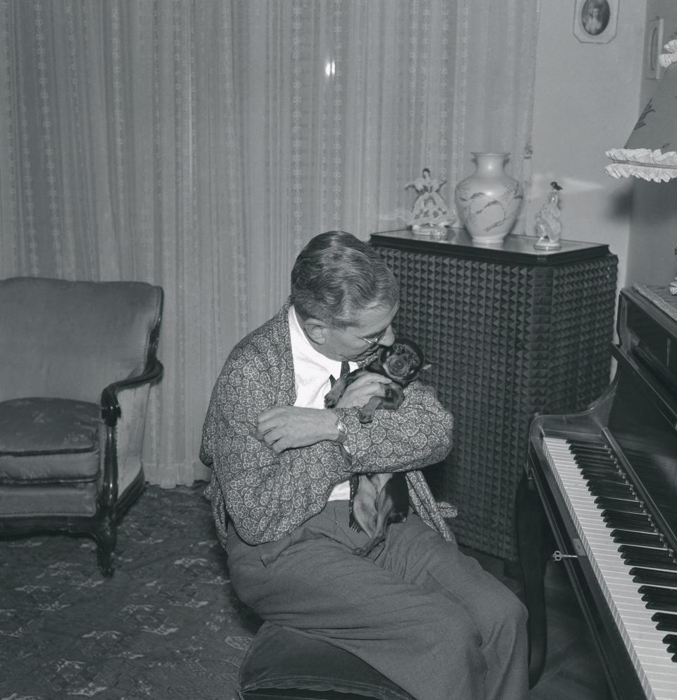 Luciano with his beloved dog during his enforced stay home evenings.