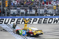 Kyle Busch celebrates with the fans after winning the NASCAR Xfinity Series auto race at Nashville Superspeedway on Saturday, June 19, 2021, in Lebanon, Tenn. (AP Photo/Mark Humphrey)