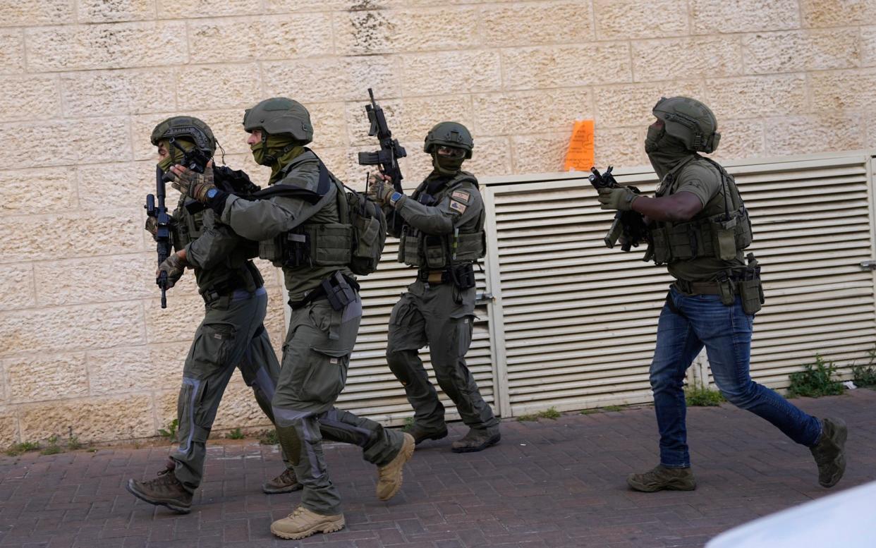 Israeli forces pursue suspected attackers in a ramming attack that wounded three people