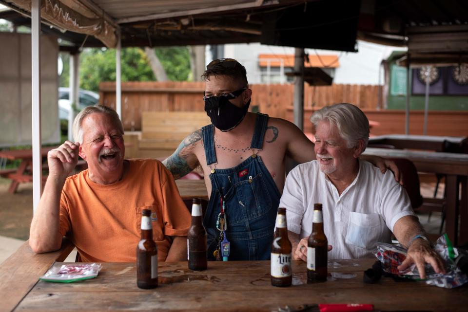 Patrons at the West Alabama Ice House have beers before Texas Governor Greg Abbotts order that all bars are to be closed at noon today in Houston, Texas on June 26, 2020. / Credit: MARK FELIX/AFP /AFP via Getty Images