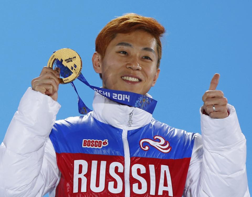 Gold medallist Russia's Victor An celebrates during the victory ceremony for the men's 1,000 metres short track speed skating finals at the 2014 Sochi Winter Olympics February 15, 2014. REUTERS/Shamil Zhumatov