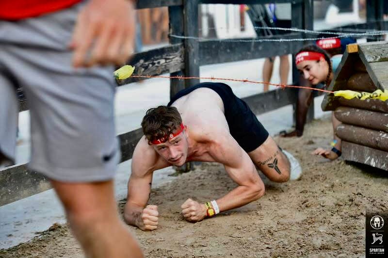 Ohio State men's basketball player Colby Baumann competes in a Spartan Race.