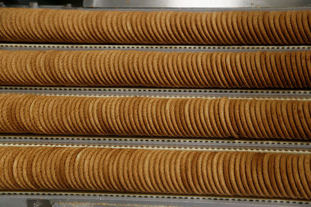 Biscuits are prepared for packaging on the production line of Pladis' McVities factory in London Britain, September 19, 2017. Picture taken September 19, 2017. REUTERS/Peter Nicholls.