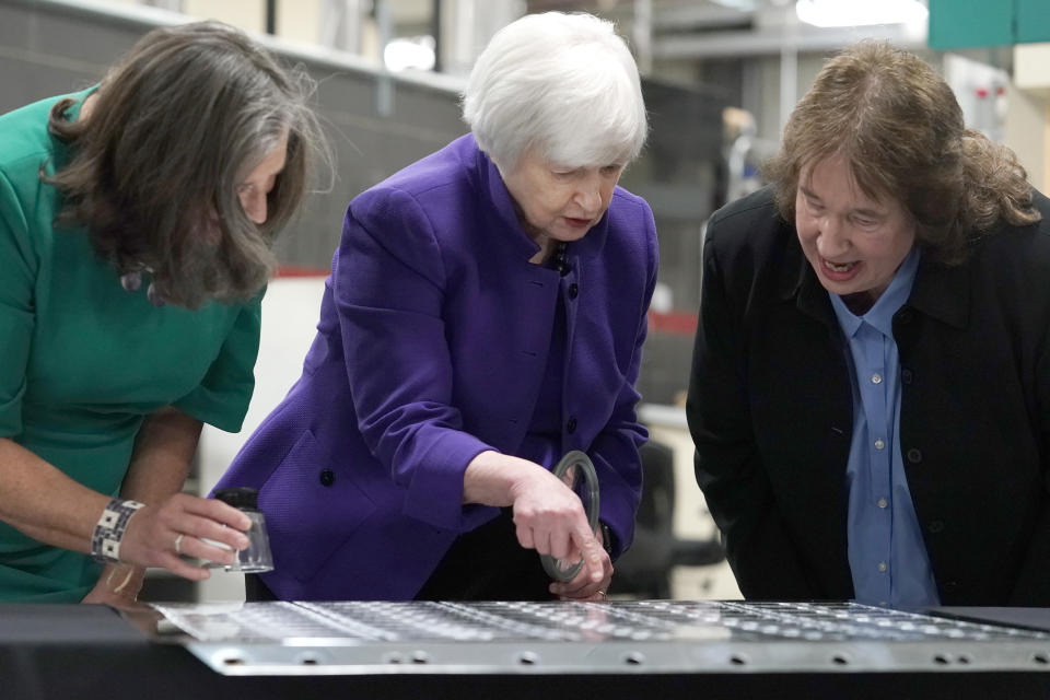 Secretary of the Treasury Janet Yellen, center, and Treasurer of the United States Chief Lynn Malerba, left, inspect printing plates with Deputy Director Charlene Williams during a visit to the Bureau of Engraving and Printing's (BEP) Western Currency Facility in Fort Worth, Texas, Thursday, Dec. 8, 2022. Yellen unveiled the first U.S. currency bearing her signature, marking the first time that U.S. bank notes will bear the name of a female treasury secretary. (AP Photo/LM Otero)