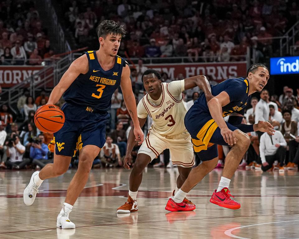 West Virginia guard guard Kerr Kriisa (3) dribbles the ball towards the Texas Longhorns basket during the basketball game at the Moody Center on Saturday, Feb. 10, 2024 in Austin.