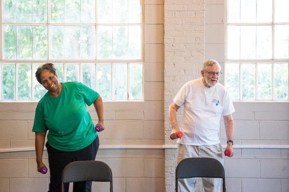 Jaime Berry, 59, left, and Tom Hooker, 72, right, work out during an exercise class June 21 at the Bexley Senior Center.