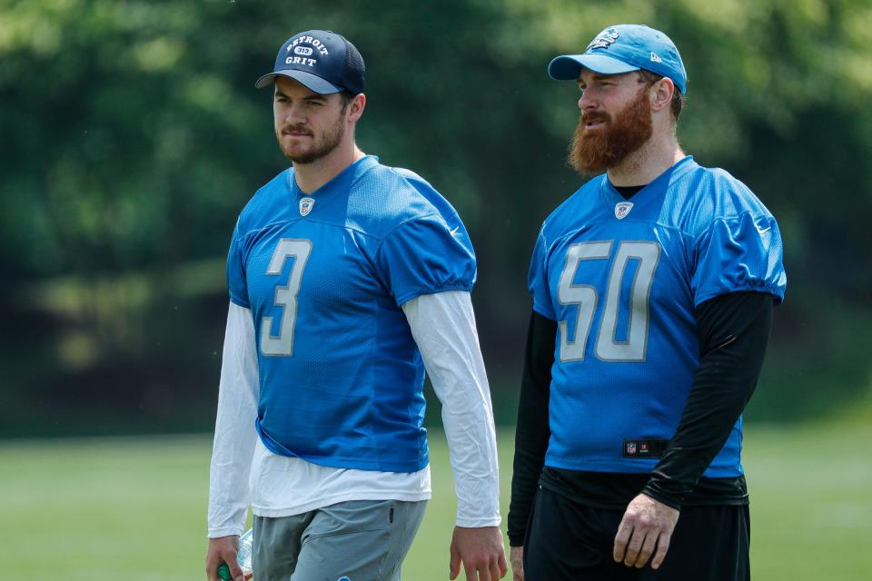 Lions punter Jack Fox, left, talks to long snapper Jake McQuaide after practice during minicamp at in Allen Park on Wednesday, June 7, 2023.