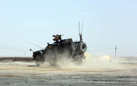 A U.S. armoured fighting vehicle returns to a base near West Mosul, Iraq June 21, 2017, after a mission into the city where Iraqi security forces are fighting Islamic State. REUTERS/Marius Bosch