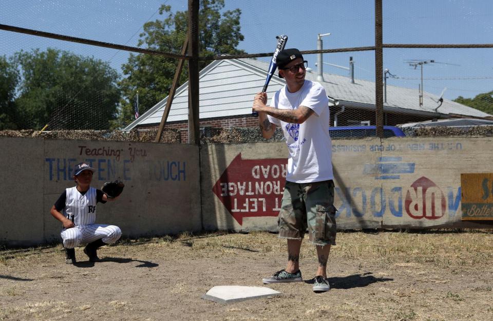 Nathan Espinoza catches as Chauncey Leopardi, who played Squints in "The Sandlot," waits for a pitch on the field where "The Sandlot" was filmed in Salt Lake City on July 20, 2013. "The Sandlot" is one of many films shot in Utah over the past few decades.