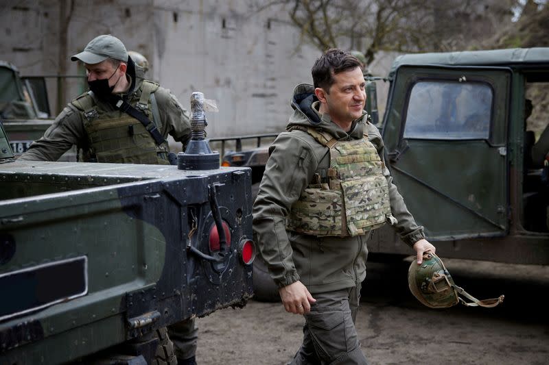 FILE PHOTO: Ukraine's President Volodymyr Zelenskiy visits positions of armed forces in Donbass region