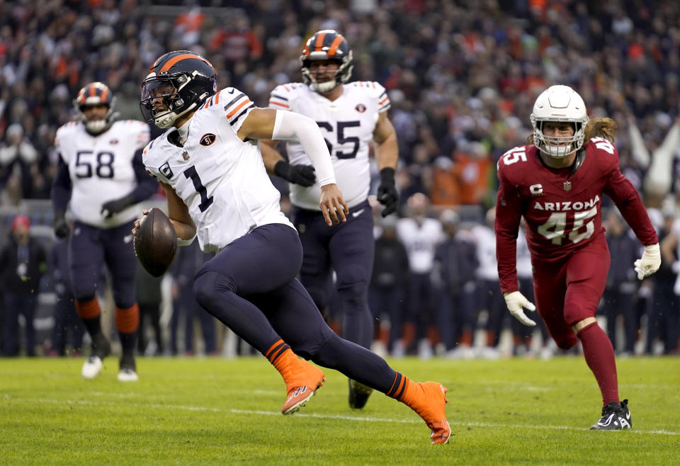 Chicago Bears quarterback Justin Fields heads too the end zone for a touchdown during the first half of an NFL football game against the Arizona Cardinals Sunday, Dec. 24, 2023, in Chicago. (AP Photo/Erin Hooley)