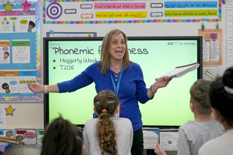Jamie Dollopf teaches a reading lesson to her first-grade class at a school in Wisconsin.