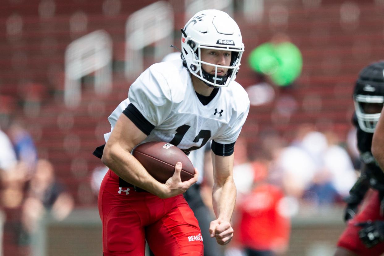 Bearcats quarterback Brady Drogosh, shown during the spring scrimmage last April, is being moved to linebacker this season.